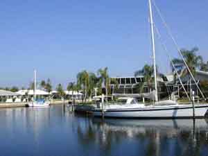 Typical Punta Gorda Isles home with boat docked out back.